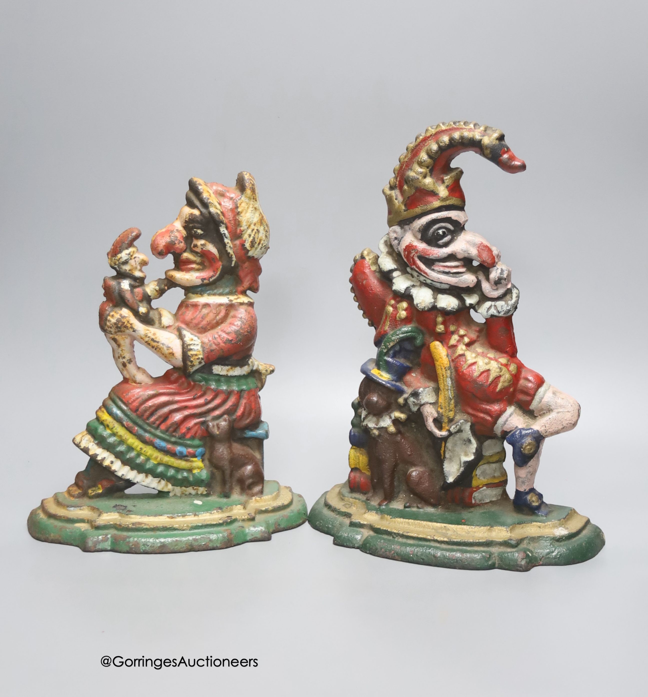A pair of painted cast iron Punch and Judy door stops, height 30cm
